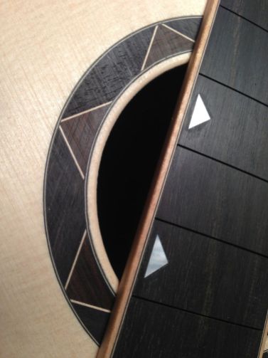 Geometric fingerboard inlay and rosette